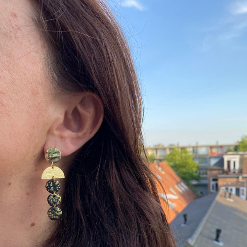 Black earrings with gold flakes