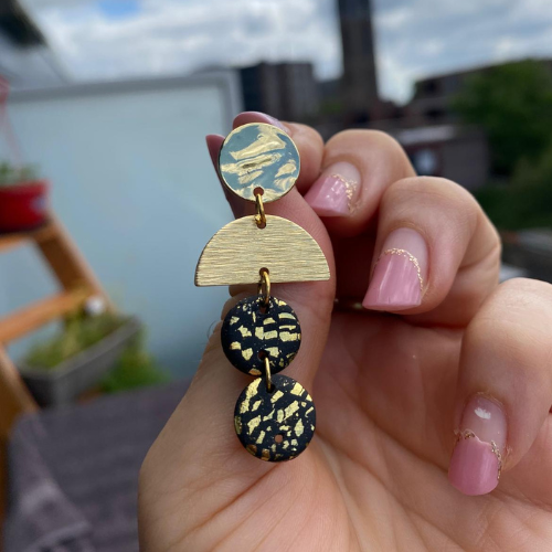 Black earrings with gold flakes